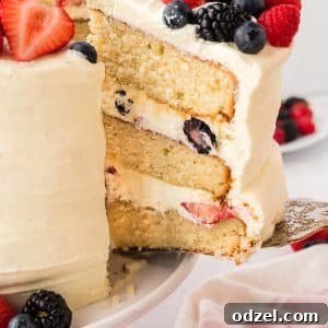 Light and Creamy Chantilly Cake Recipe for Special Occasions 12 A slice being pulled from a whole Chantilly cake.