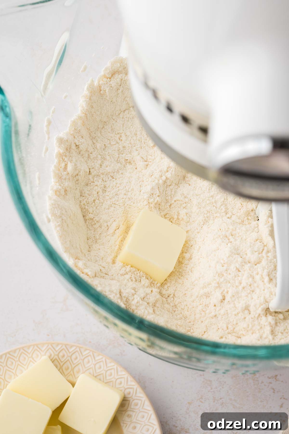 Light and Creamy Chantilly Cake Recipe for Special Occasions 3 Butter and flour being mixed in a stand mixer.