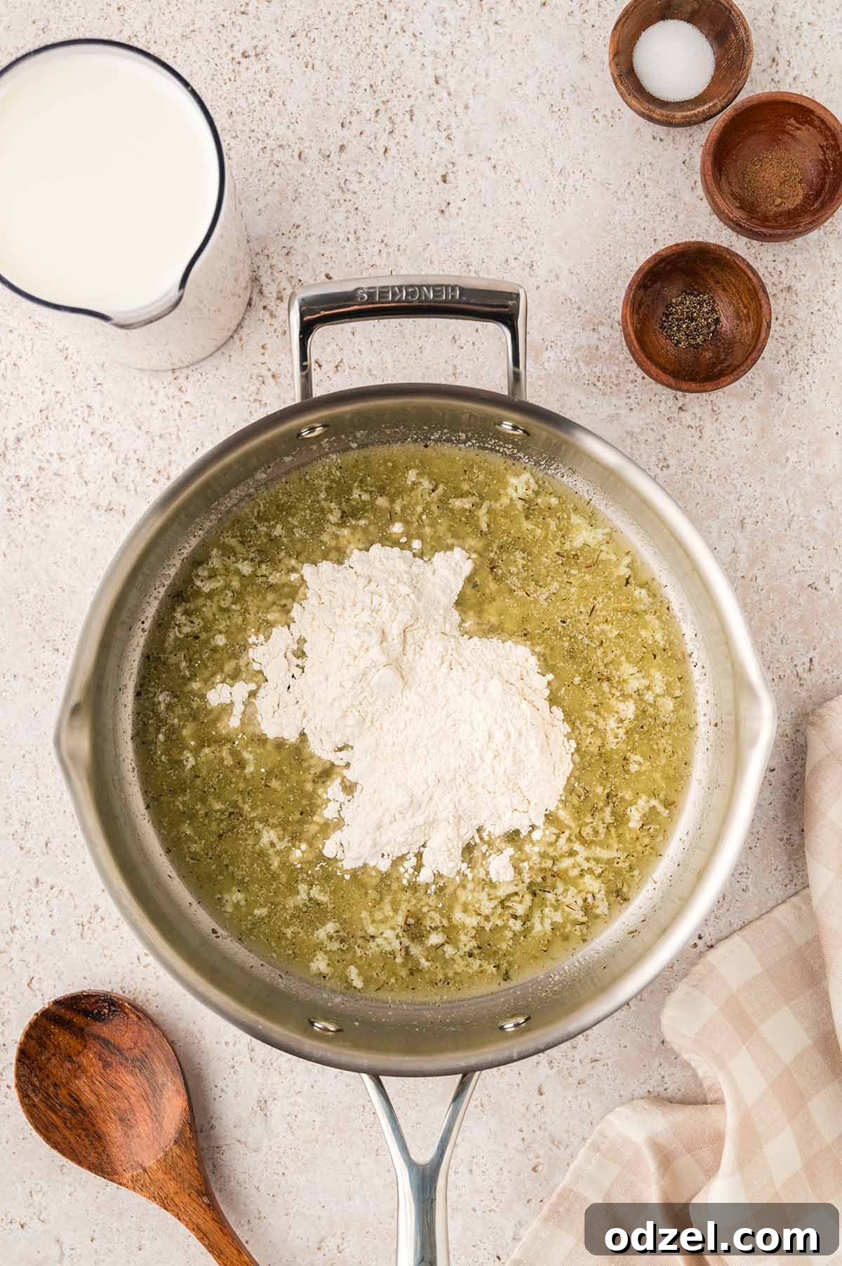 Creamy Pesto Chicken Lasagna Recipe 5 Melted butter, garlic, and flour in a skillet.