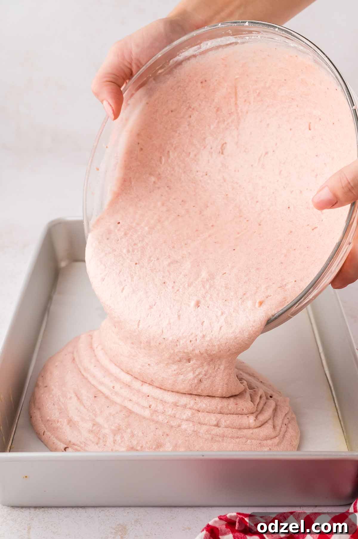 Moist Fresh Strawberry Sheet Cake Recipe 6 Cake batter being poured into a 9x13 baking dish.