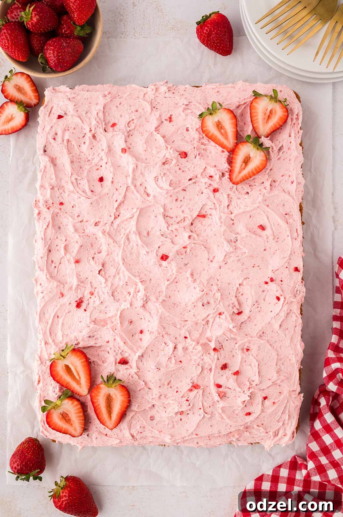Moist Fresh Strawberry Sheet Cake Recipe 8 9x13 strawberry cake decorated with buttercream and fresh strawberries.