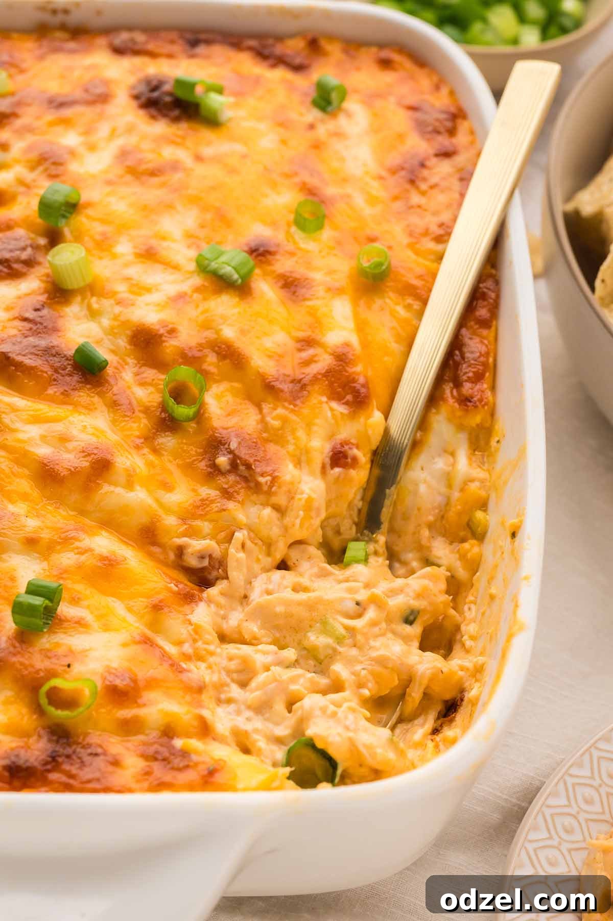 Classic Buffalo Chicken Dip Recipe 6 baked buffalo chicken dip with a spoon.