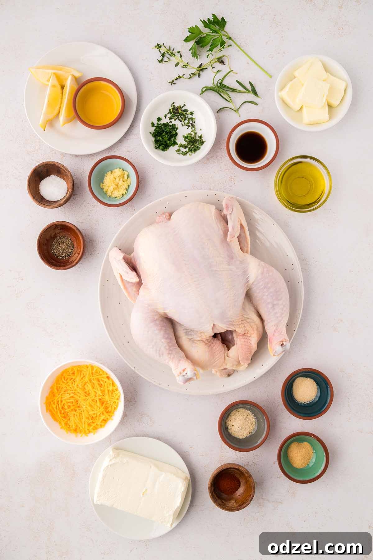 Copycat Ruth's Chris Stuffed Chicken Recipe 3 raw whole chicken, lemon, butter, herbs, spices, garlic, oil, and cheese.