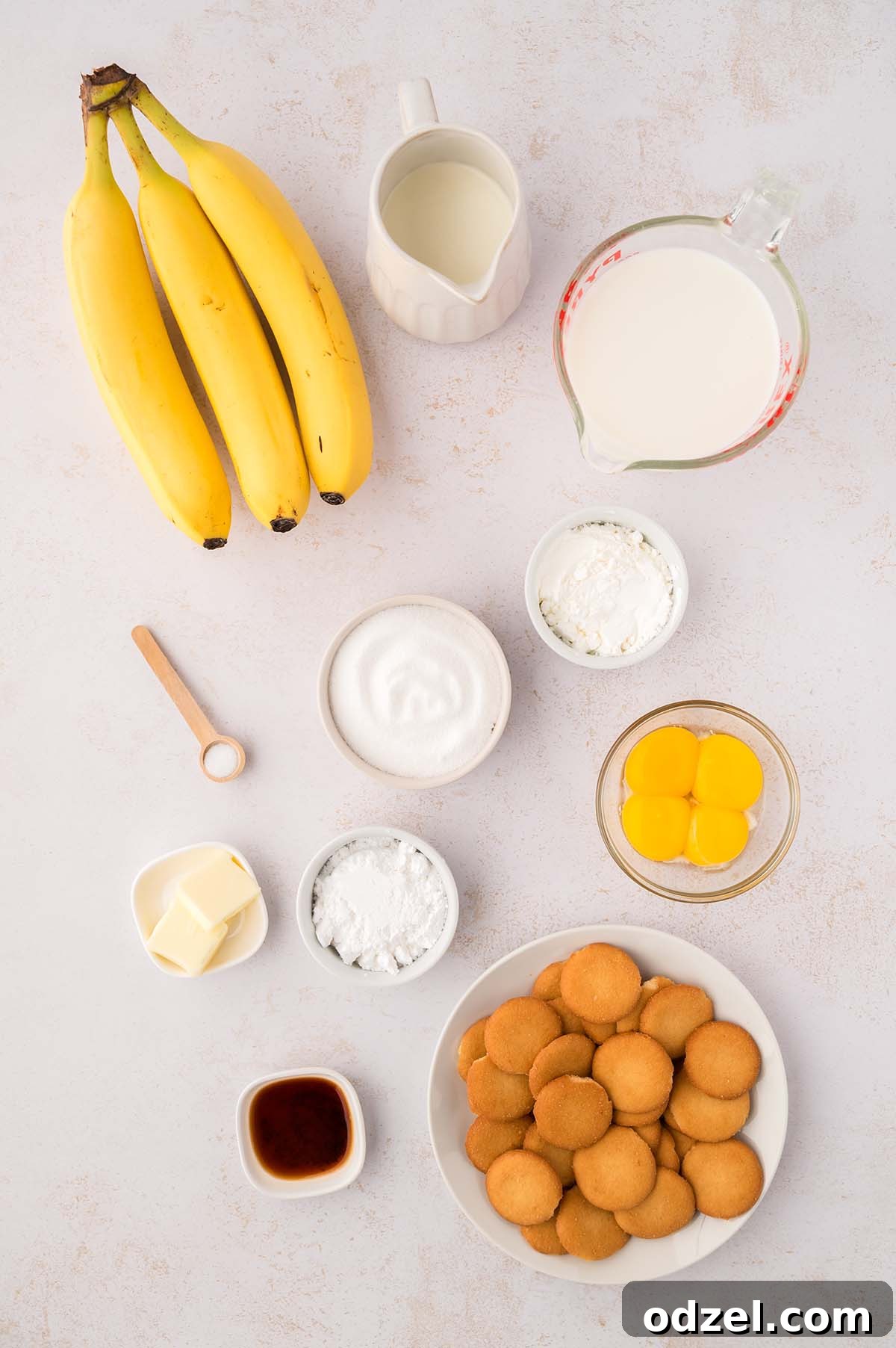 Southern Classic Banana Pudding Recipe 4 photo of milk, heavy cream, yolks, bananas, sugar, butter, vanilla extract, vanilla wafers, corn starch, and salt.