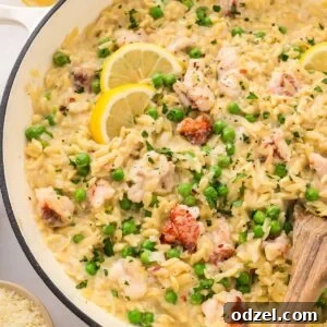 lemon garlic lobster orzo in a white skillet.