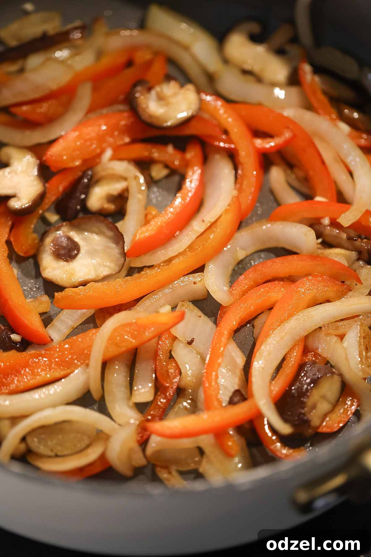 vegetables cooking in a skillet.