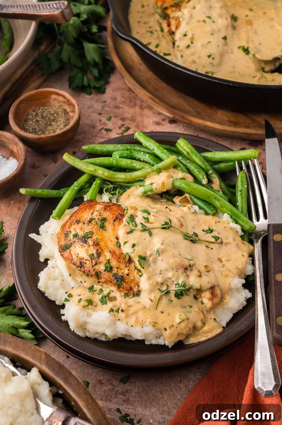 creamy chicken with mashed potatoes and green beans.