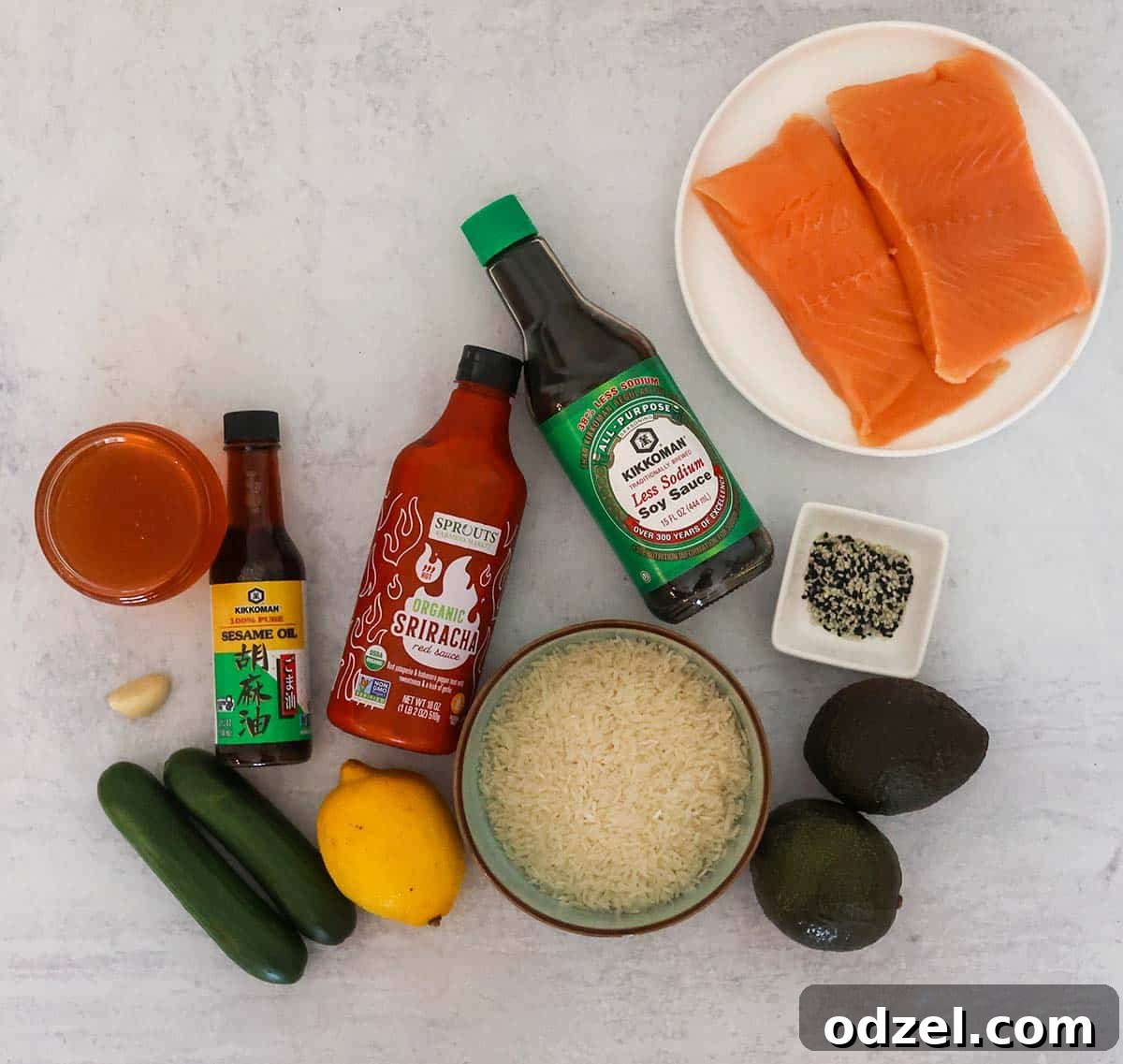 Salmon and Avocado Rice Bowls with Sesame Soy Dressing 3 salmon, sauces, rice, avocado, honey, lemon, cucumbers, sesame seeds, and garlic.
